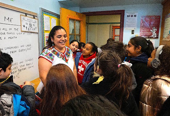 Students gather around Montse Olmos Tlalcihuatzin after their interview with her. Said one student, “Montse’s story is also my story.”